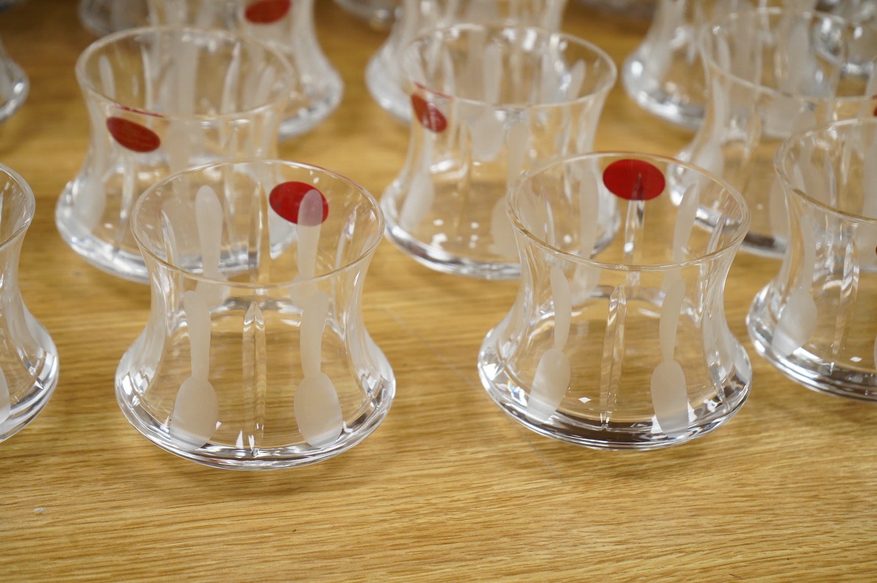 A collection of twenty five Uri Geller Crystal Collection whisky tumblers by Dickenson Crystal, 9cm high
